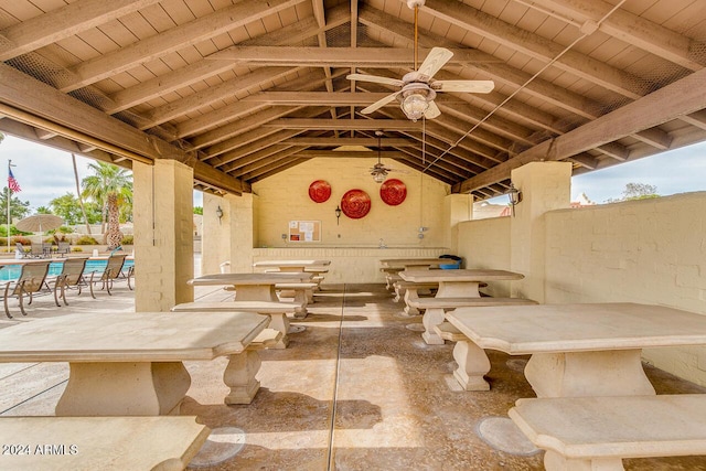 view of patio with ceiling fan and a community pool