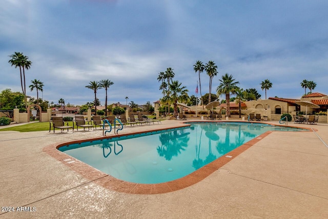 view of swimming pool with a patio area