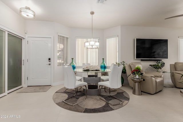 dining area with an inviting chandelier