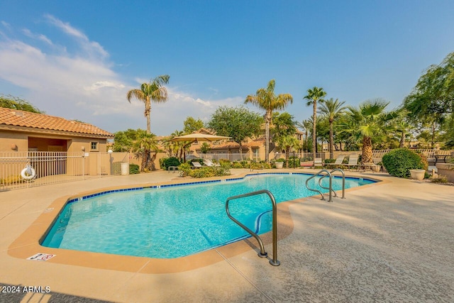 view of swimming pool featuring a patio area