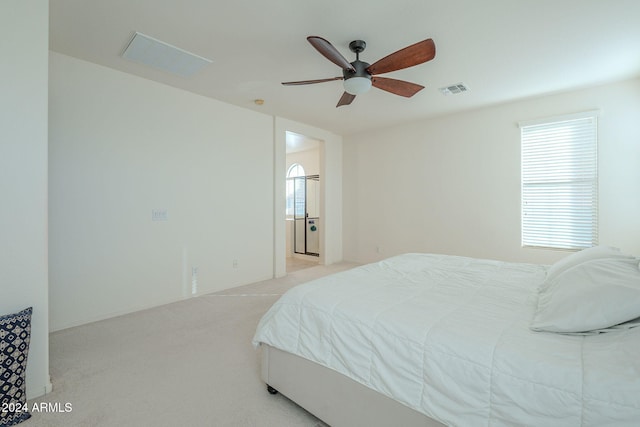 bedroom featuring ceiling fan, visible vents, and light colored carpet