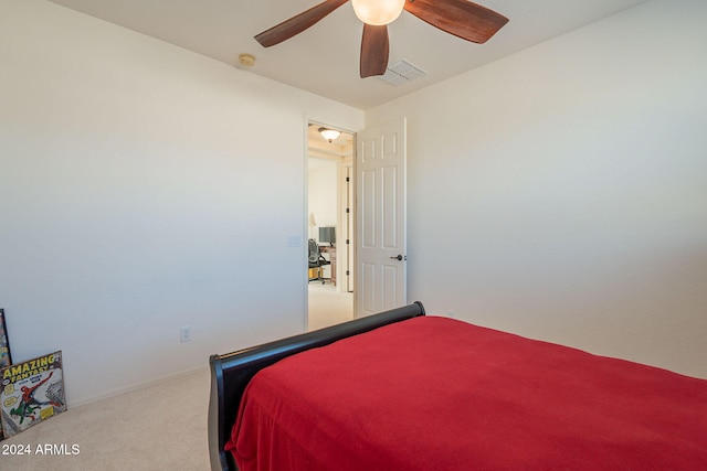 bedroom featuring carpet floors, visible vents, and a ceiling fan