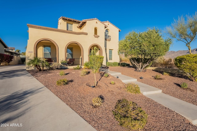 mediterranean / spanish-style home featuring a porch