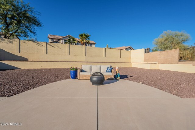 view of patio featuring a fenced backyard and an outdoor living space