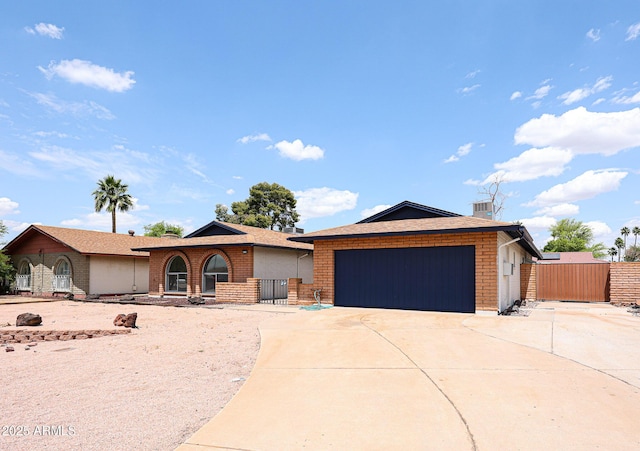 4528 W Butler Dr, Glendale, AZ 85302 - single story home featuring concrete driveway, an attached garage, brick siding, and fence