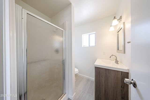 4528 W Butler Dr, Glendale, AZ 85302 - full bath with vanity, a stall shower, toilet, and baseboards