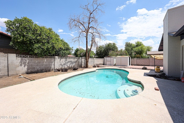 4528 W Butler Dr, Glendale, AZ 85302 - view of pool with a storage unit, a fenced backyard, a patio area, and an outdoor structure
