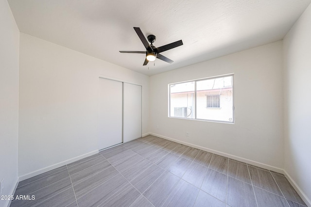 4528 W Butler Dr, Glendale, AZ 85302 - unfurnished bedroom featuring a closet, baseboards, and ceiling fan