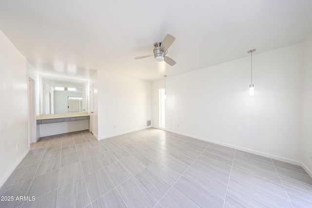 4528 W Butler Dr, Glendale, AZ 85302 - empty room with a ceiling fan and baseboards