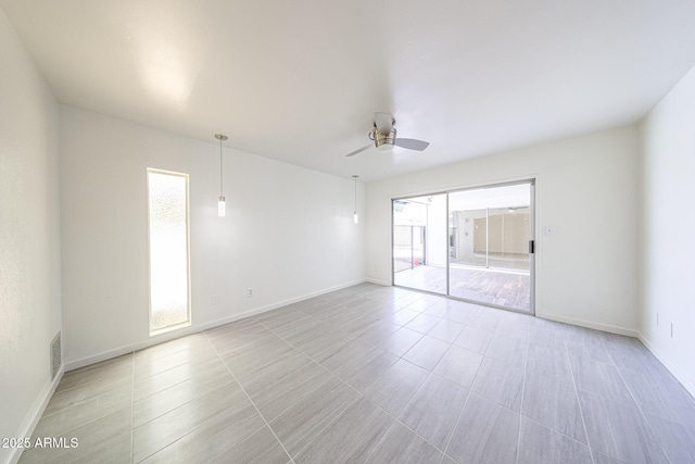 4528 W Butler Dr, Glendale, AZ 85302 - spare room featuring ceiling fan and baseboards