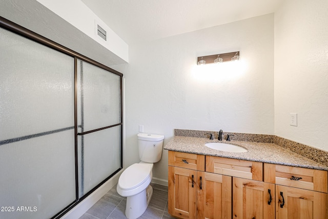 4528 W Butler Dr, Glendale, AZ 85302 - bathroom with a stall shower, vanity, toilet, and tile patterned flooring