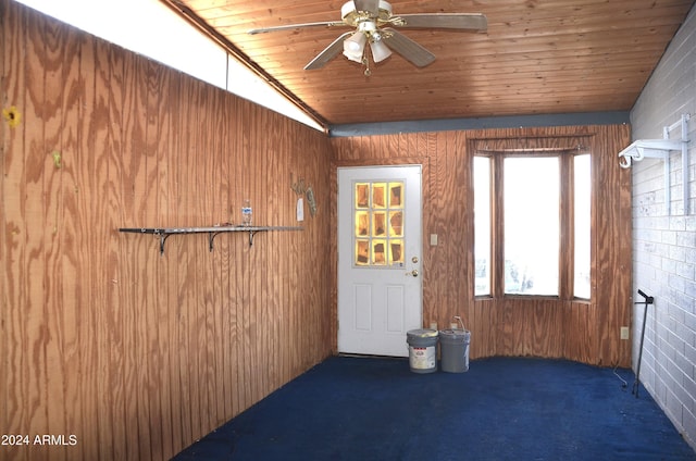 655 W Caroline St, Coolidge, AZ 85128 - interior space featuring dark carpet, vaulted ceiling, ceiling fan, wood ceiling, and brick wall