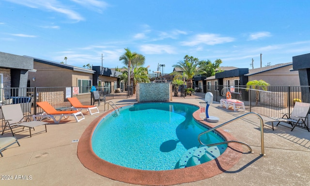 view of swimming pool with a patio