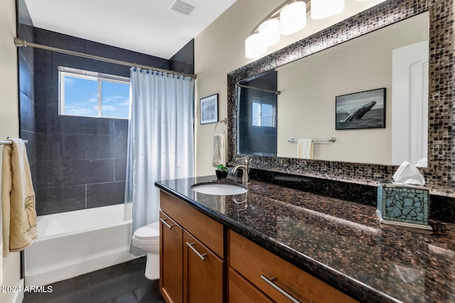 full bathroom with vanity, toilet, backsplash, and shower / tub combo with curtain