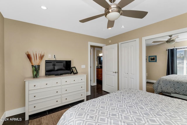 bedroom featuring dark hardwood / wood-style flooring, a closet, and ceiling fan