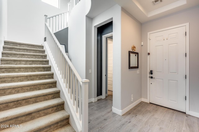 foyer entrance with light hardwood / wood-style flooring