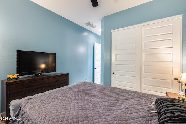 bedroom with ceiling fan and a closet