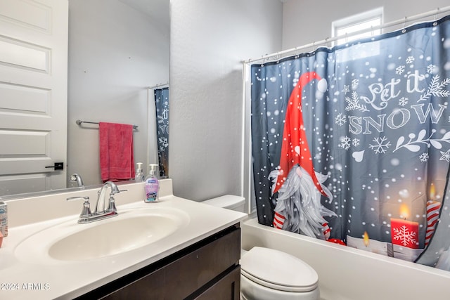 full bathroom with vanity, shower / bath combination with curtain, and toilet