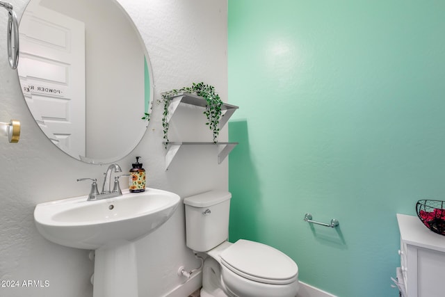 bathroom with sink and toilet