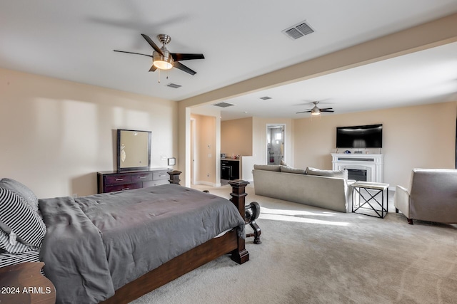 bedroom with light carpet and ceiling fan