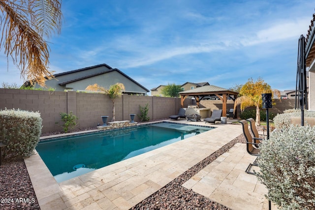 view of swimming pool featuring a gazebo and a patio area