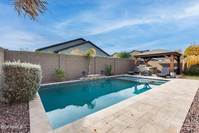 view of swimming pool with a gazebo and a patio area