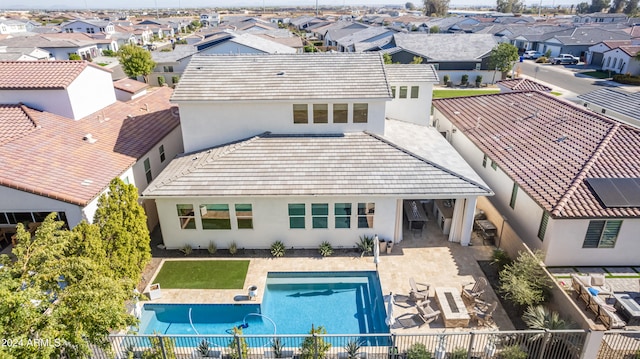 back of property featuring a patio area