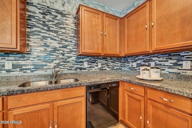 kitchen with sink, light stone counters, tasteful backsplash, black dishwasher, and tile patterned flooring