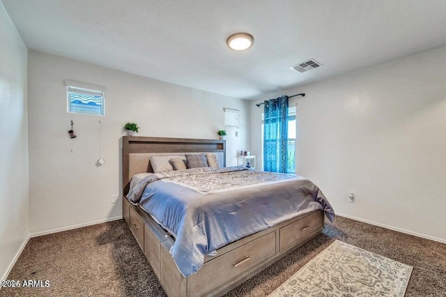 bedroom featuring dark carpet