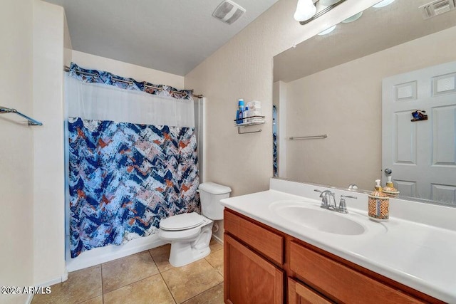 bathroom with tile patterned flooring, vanity, a shower with shower curtain, and toilet