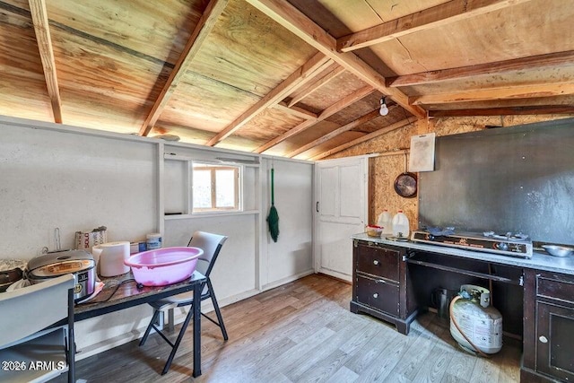 interior space with light hardwood / wood-style flooring and wooden ceiling