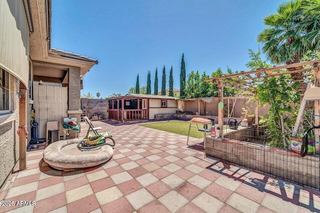 view of patio / terrace featuring an outdoor structure and a pergola