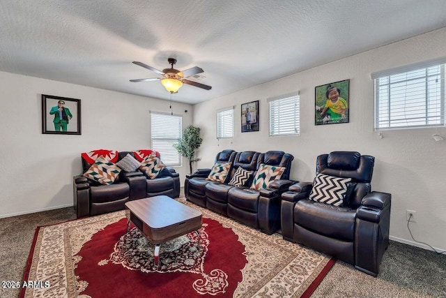 carpeted living room featuring a textured ceiling and ceiling fan