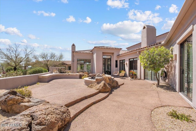 back of house featuring a patio