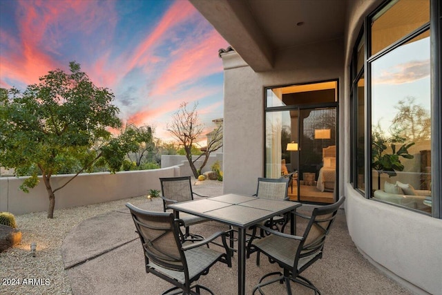 view of patio terrace at dusk