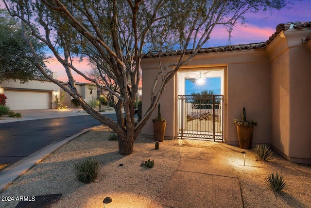 view of gate at dusk