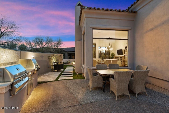 view of patio with a grill and area for grilling