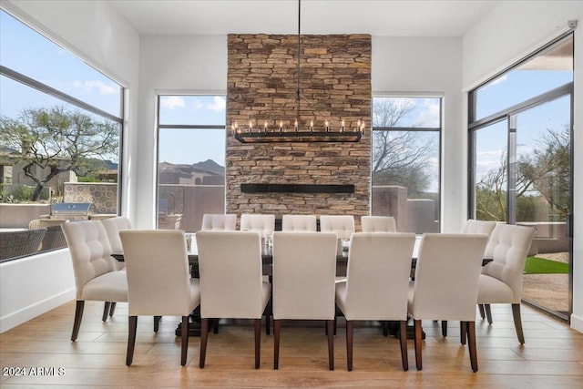 dining space featuring plenty of natural light, a chandelier, and light hardwood / wood-style floors