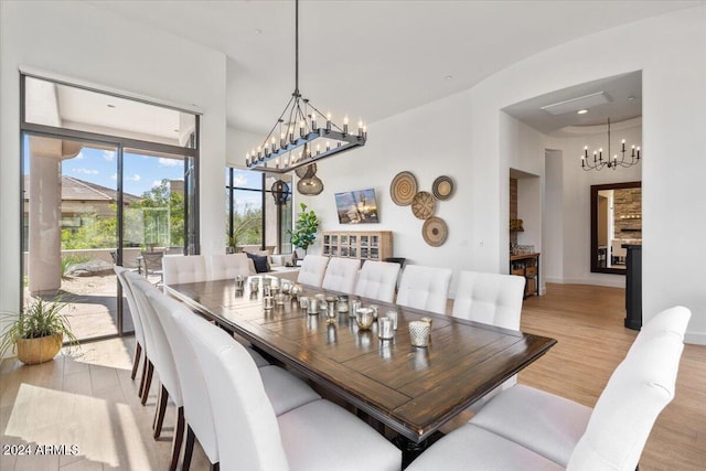 dining space with light hardwood / wood-style floors