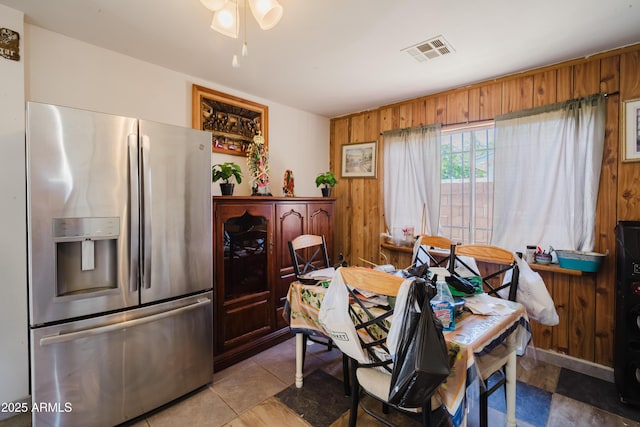 5637 N 63rd Dr, Glendale, AZ 85301 - dining space with a ceiling fan and wood walls