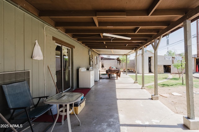 5637 N 63rd Dr, Glendale, AZ 85301 - view of patio / terrace with washer / clothes dryer and an outbuilding