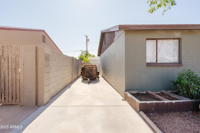 5637 N 63rd Dr, Glendale, AZ 85301 - view of home's exterior featuring a patio and concrete block siding