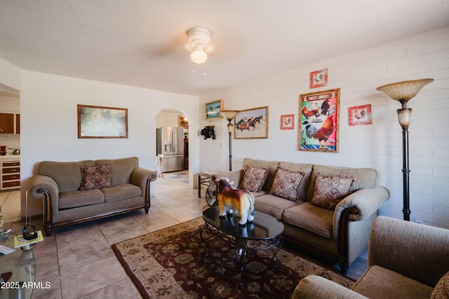 5637 N 63rd Dr, Glendale, AZ 85301 - living room with arched walkways, ceiling fan, and light tile patterned floors
