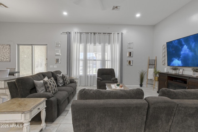 living room with recessed lighting and visible vents