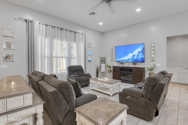 living area with light tile patterned floors, visible vents, ceiling fan, and recessed lighting
