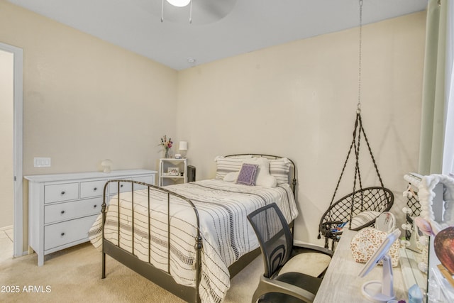 carpeted bedroom with ceiling fan and baseboards