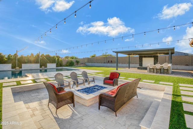 view of patio featuring a fire pit, a fenced in pool, a fenced backyard, and outdoor dry bar