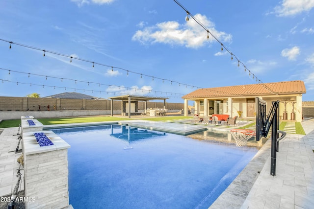 view of swimming pool featuring a fenced in pool, a patio area, and a fenced backyard