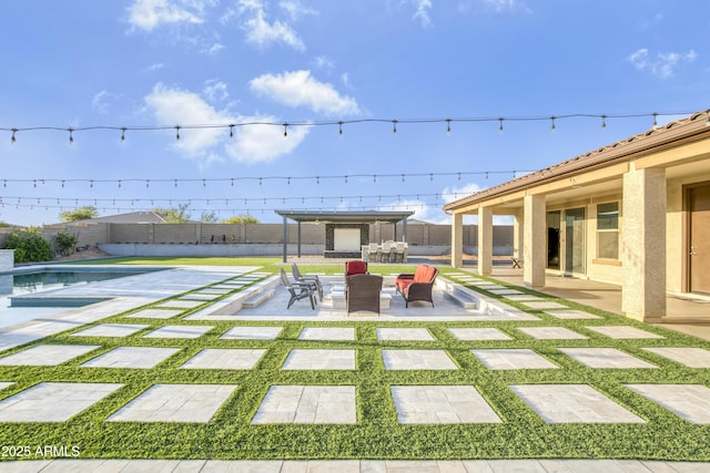 view of yard featuring a patio, a fenced in pool, and a fenced backyard