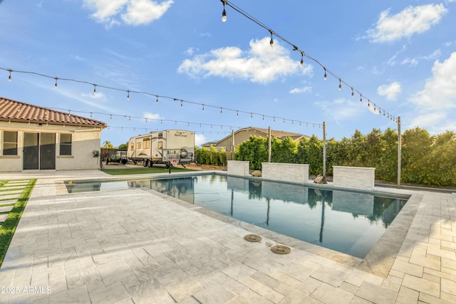 outdoor pool featuring a patio area
